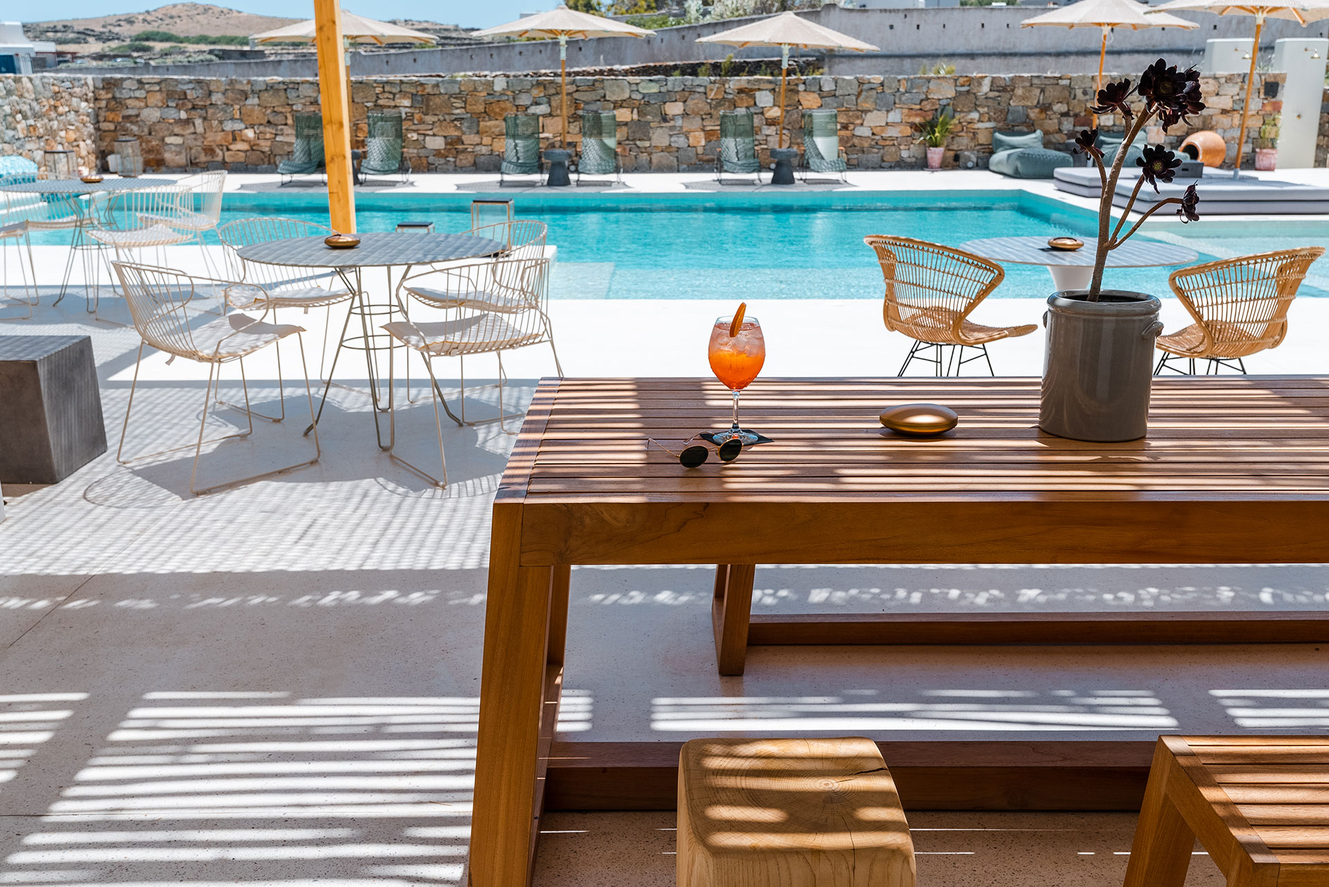 Koukoumi Vegan Hotel bar outdoor sitting area in front of the pool